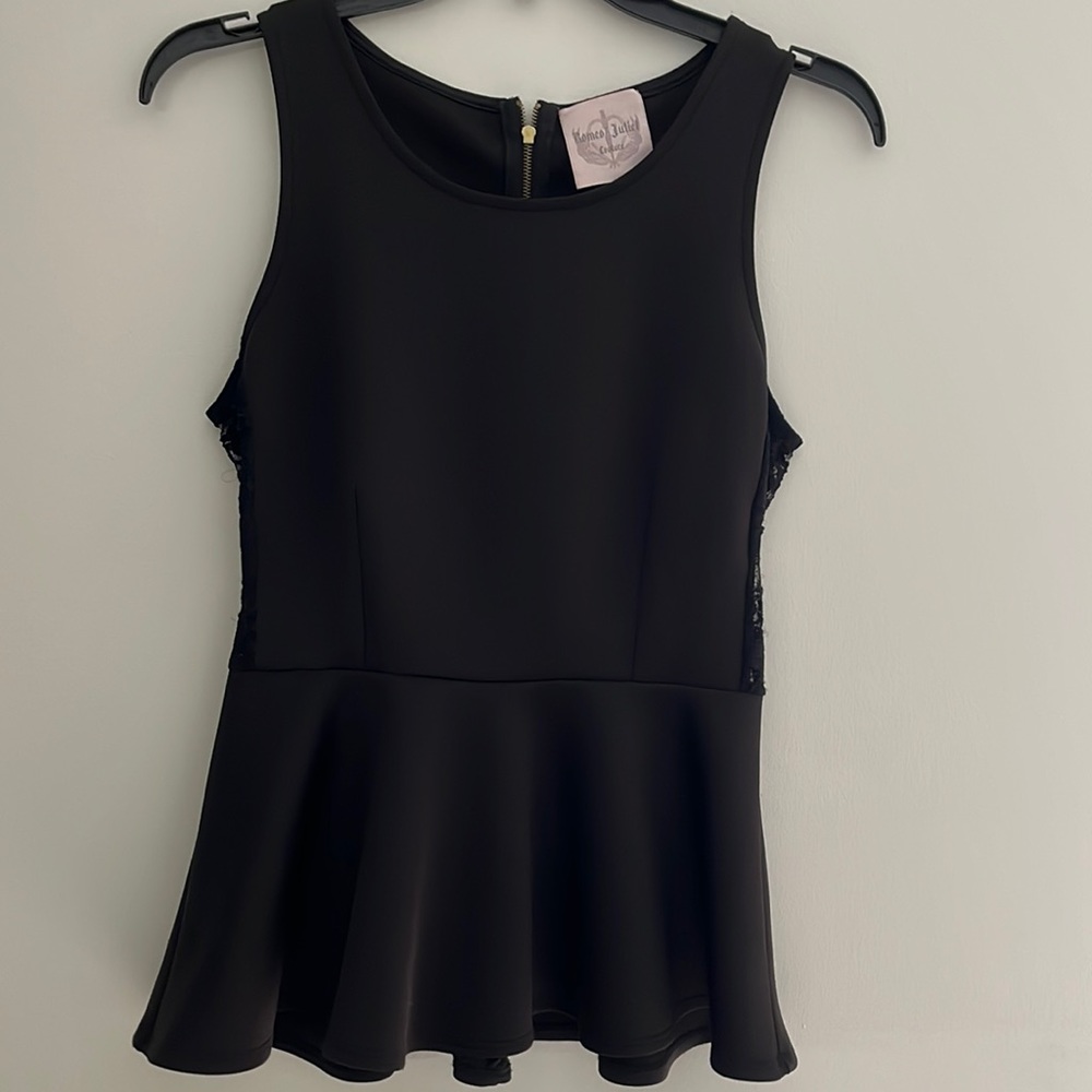 Romeo & Juliet Peplum black top. Lace sides, zip back. Scuba material.  Size S.